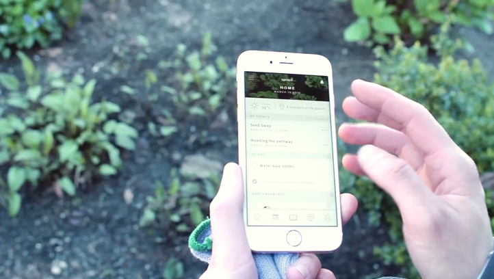 Person holding phone with the Sprout app on the screen.